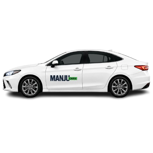 Professional airport pickup taxi service by Manju Cabs with a driver welcoming passengers for a safe and comfortable transfer.